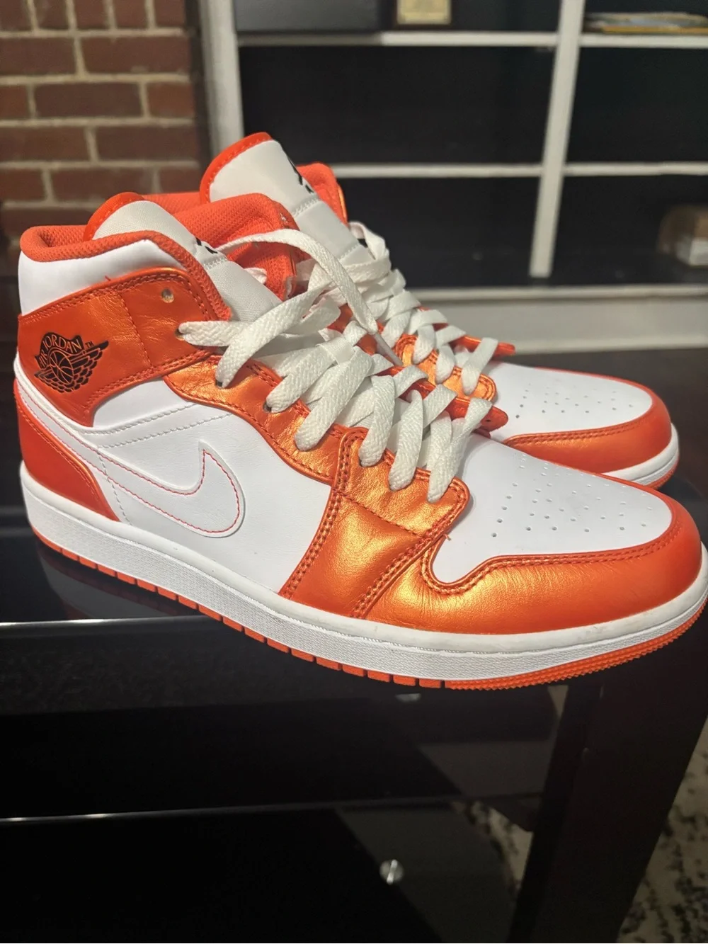 Jordan 1 Mid in White and Metallic Orange